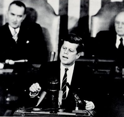 A photo of President John F. Kennedy giving a speech to Congress and the nation