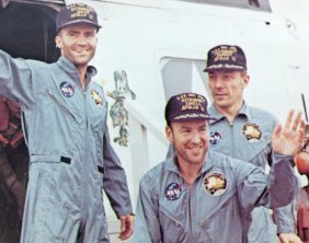 A photo of astronauts,Haise,Lovell, and Swigert