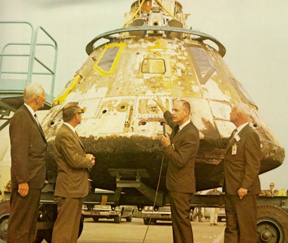 A photo of Ruud,Myers,Low and Gilruth inspecting the CM