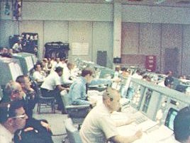 A photo of operation team members working in the Mission Operations Control Room