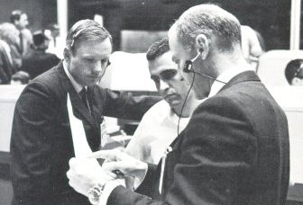 A photo of astronauts,Armstrong,Aldrin, and Schmitt discussing