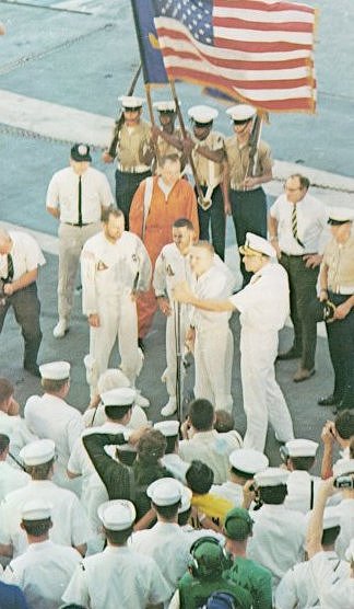 A photo of astronauts,Borman,Lovell, and Anders on USS Yorktown