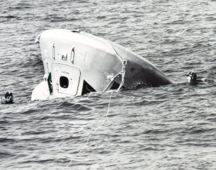 A photo of Apollo 7 command module splashed down upside-down